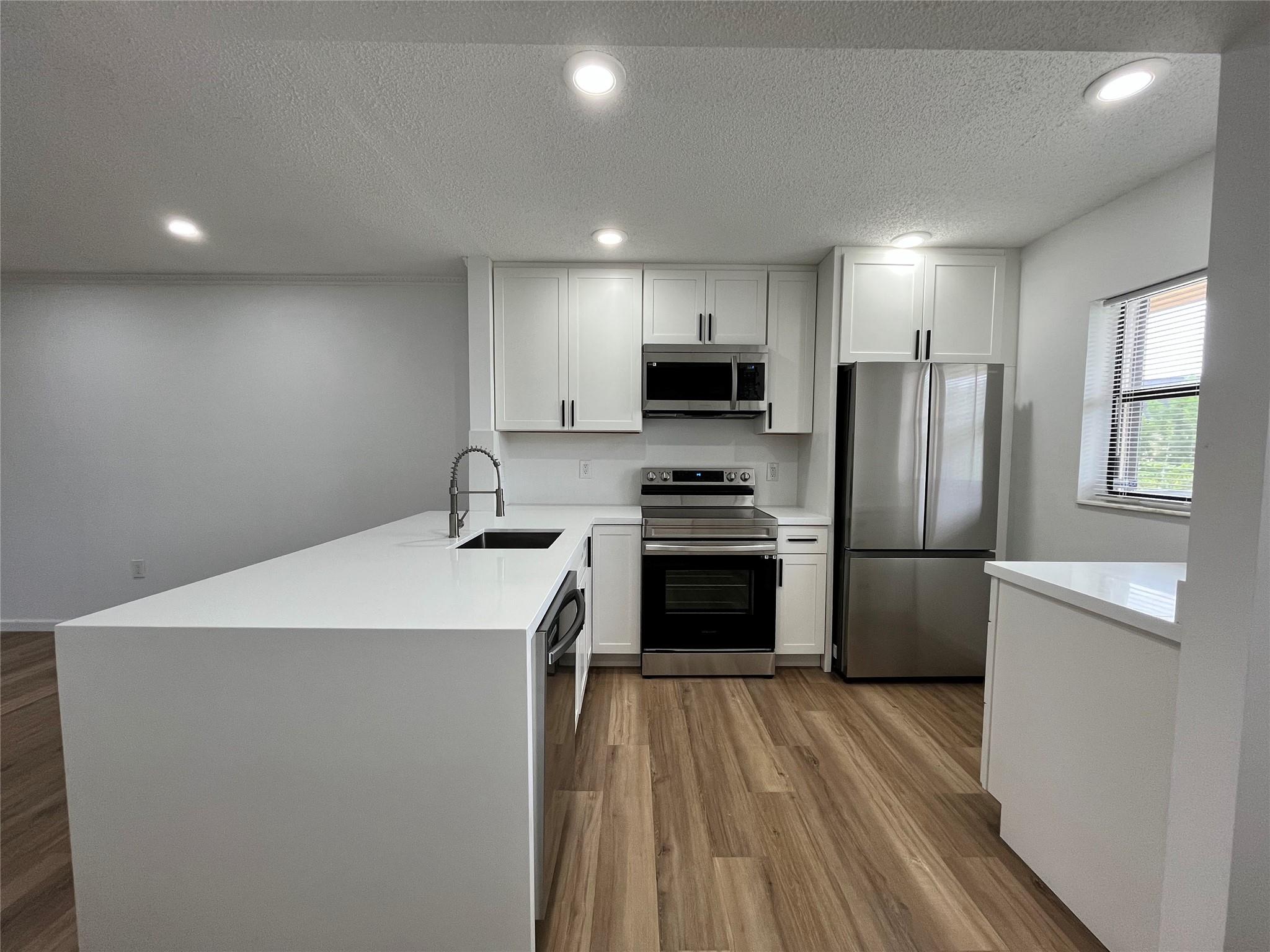 Come see this dazzling completely remodeled 2 beds/ 2 baths lakefront condo. The apartment flows into a bright, open-concept living, dining, and kitchen area, featuring brand-new ss appliances, quartz countertops, recessed lighting, and luxury vinyl floors. Fabulous layout with all the right spaces and plenty of storage. The lakefront master bedroom allows the desired privacy with a full bathroom and a walk-in closet. Indulge on the balcony overlooking the lake, enjoy the afternoons over the pool after a busy day at work, or take advantage of the private tennis court to improve your sportsmanship. Located in the beautifully treed Pine Lake community, and just blocks away from restaurants, supermarkets, shopping malls, and schools. Don't wait any longer and call today for a private showing.