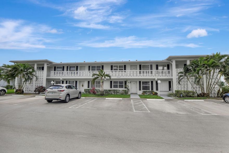 Bright First Floor Corner 2 Bedroom 2 Full Bath condo on the LAKE in the 55+ community of Pines of Delray West in Delray Beach. Features include Hurricane Accordion Shutters, NEW Washer and Dryer inside, NEW A/C and NEW Garbage Disposal. Access the 160 Sq Ft Screened Patio overlooking the Lake through the Living Room. Located on a quiet street with no rear neighbors. New Roof 2023. Parking spot is right in front of the entrance. Amenities include: Clubhouse, Heated Pool and Spa, Fitness Room, Pickleball, Tennis, and planned activities. Lease after 18 months. Close to the Beach, Delray Medical Center, Restaurants, trendy Atlantic Ave, Costco and I-95.