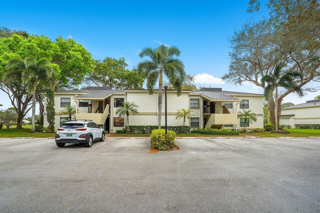 Photo of 12830 Briarlake Drive #202, Palm Beach Gardens, FL 33418 (MLS # R10958728)