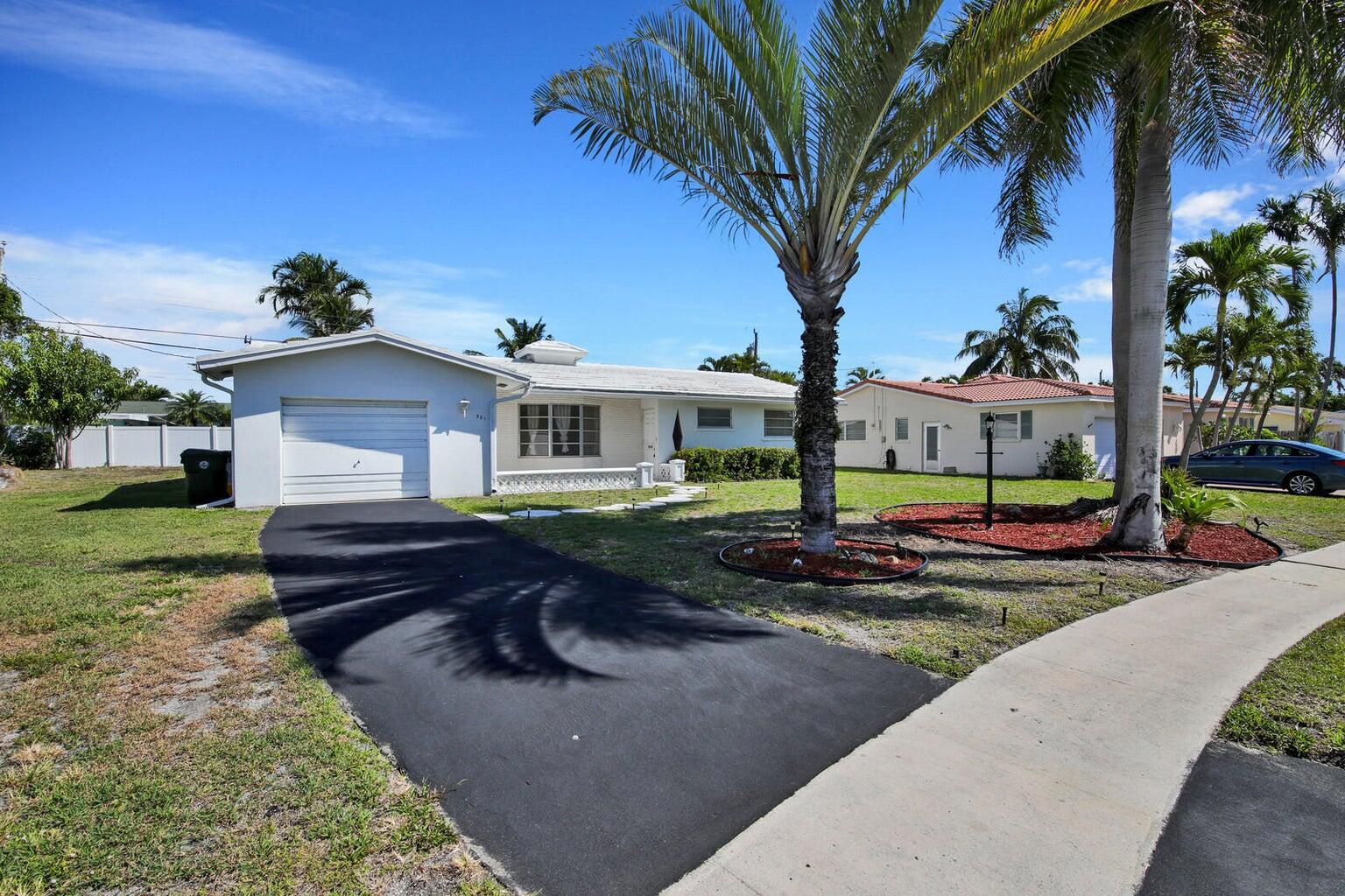 This charming East Boca Raton home has a very large and open floor plan with terrazzo flooring throughout, cove ceilings, large closets and a freshly painted interior. Two nicely sized bedrooms with plus newly updated bathrooms and newly updated kitchen. Additional features include a new AC, very large screened and covered patio on back of home that runs the entire width of home plus a one car garage. No HOA plus all ''A'' rated schools.