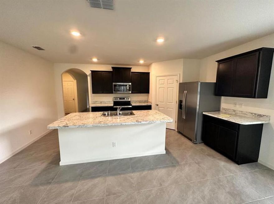 Stunning New Construction built in 2022, NO HOA. offering modern design and an open, spacious floor plan filled with natural light. This beautifully maintained home features contemporary finishes, a stylish kitchen, and comfortable living areas perfect for everyday living and entertaining.  This well-maintained property features fresh interior paint and new vinyl flooring in the bedrooms, giving the home a clean and modern feel.  very large fenced backyard, providing privacy and plenty of space for outdoor enjoyment. The property also offers peaceful waterfront views overlooking the lake, creating a serene and relaxing atmosphere right from your backyard. Located in a desirable and convenient area of Port St. Lucie, close to shopping, dining, schools, and major highways Move-in ready and available now.