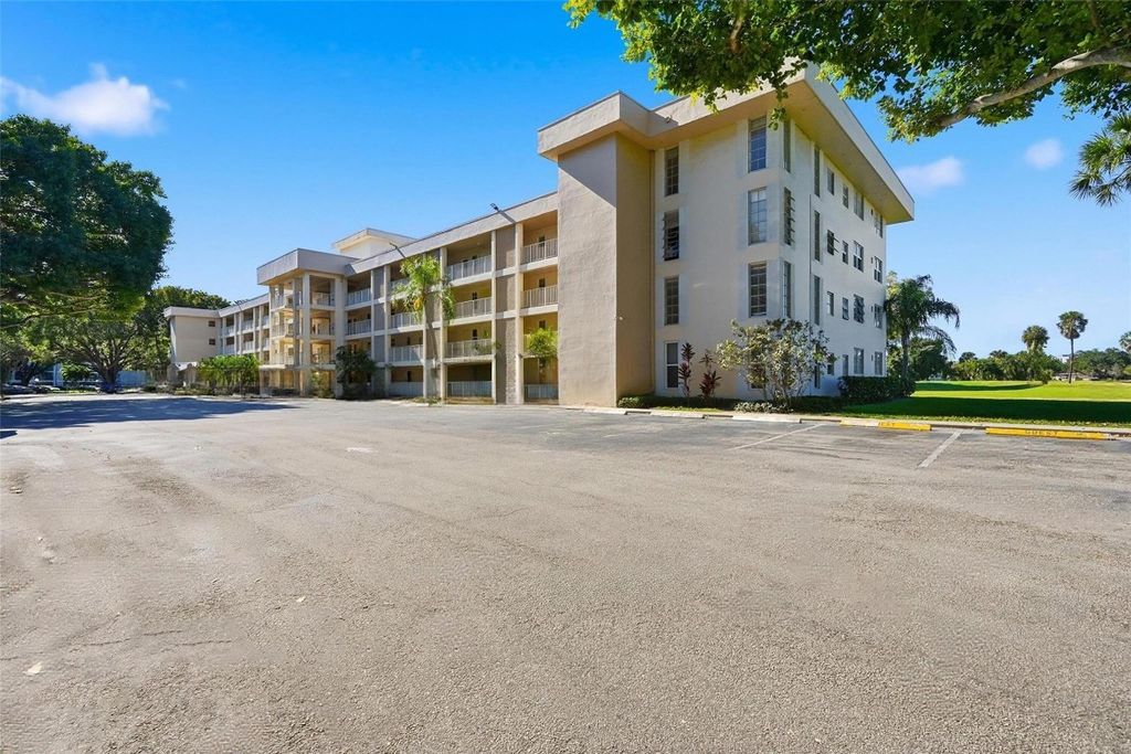 Photo of 2601 S Course Drive #202, Pompano Beach, FL 33069 (MLS # F10544419)