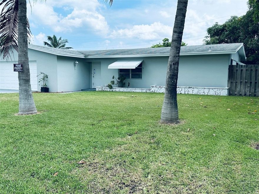 Renovated home with updated kitchen.  Large covered terrace overlooking large fenced yard.  Plenty of space for expansion.  Near I-95 for easy travel. Note: 3rd bathroom within garage appears to be without permit.  Agents please note.