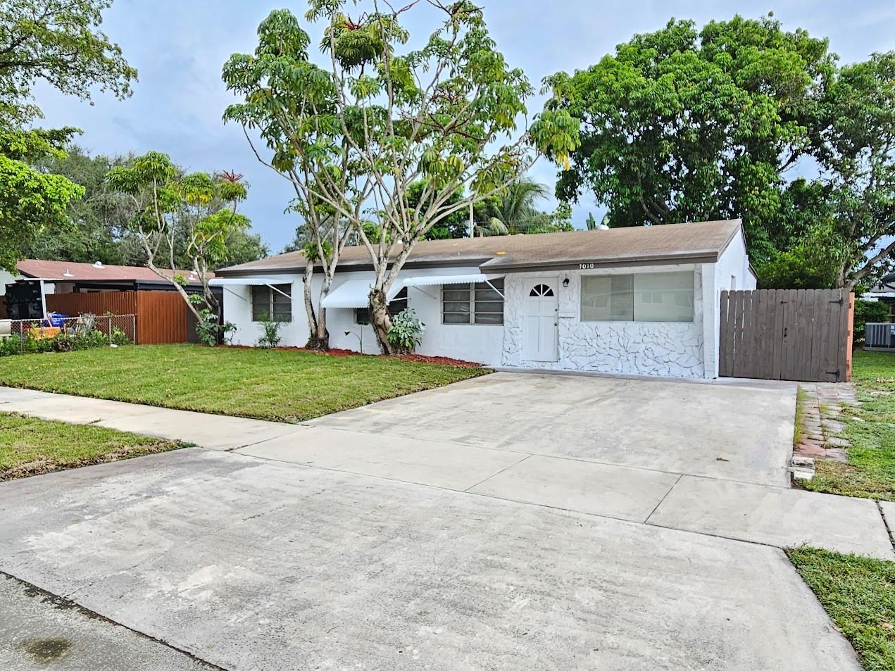 Beautiful 4 bedroom home located in West Hollywood. This home features luxury vinyl throughout, large open living areas including bonus sun room in the back overlooking the Above ground pool. Huge yard with delicious mangos tree. Extra laundry room/ work room for more storage. Kitchen and baths have been updated. Roof is only 9 years old, was installed in 2016. All new AC Duct installed as well.