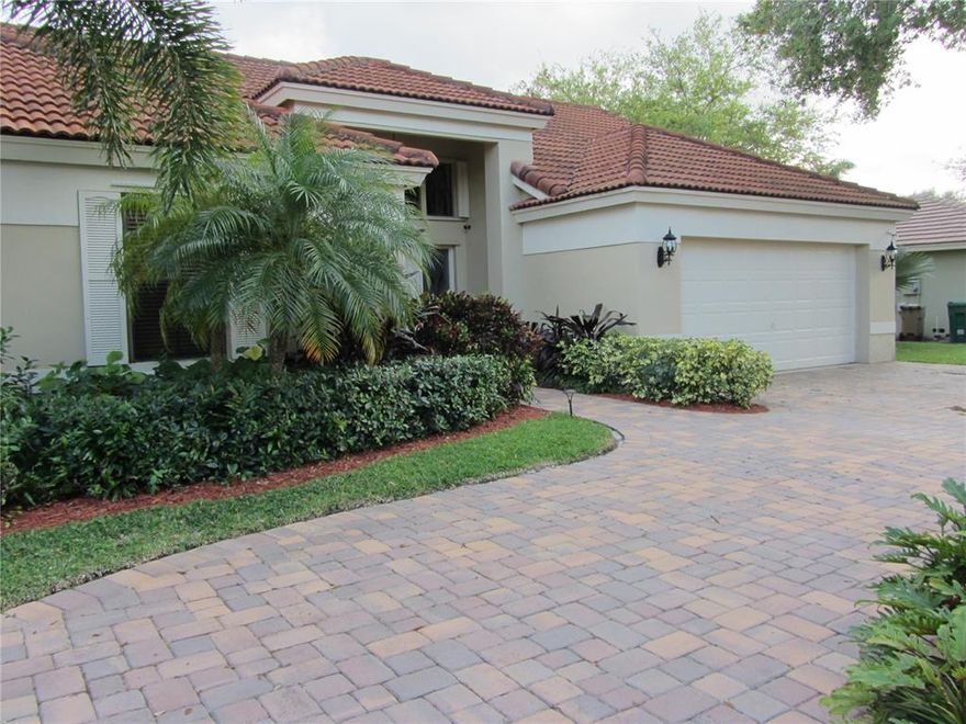 PRIDE OF OWNERSHIP INSIDE AND OUT. CIRCULAR BRICK PAVER DRIVEWAY ALLOWS FOR AMPLE PARKING. LUSH LANDSCAPING SURROUNDS THIS HOME AND CROWN MOLDING INTERIOR. NEW A/C AND WATER HEATER. ELEGANT TILE AND WOOD FLOORS THROUGHOUT. FORMAL DINING ROOM ADJOINS LIVING ROOM FOR ALL THOSE FAMILY GATHERINGS. LARGE FENCED YARD CAN BE VIEWED FROM SPACIOUS SCREENED PATIO. LARGE BEDROOMS, MASTER WITH CUSTOM CLOSET SPACE. MOST DESIRED SCHOOLS FOR THOSE BUYERS WITH CHILDEN. THIS HOME TRULY IS A GEM THAT SPARKLES