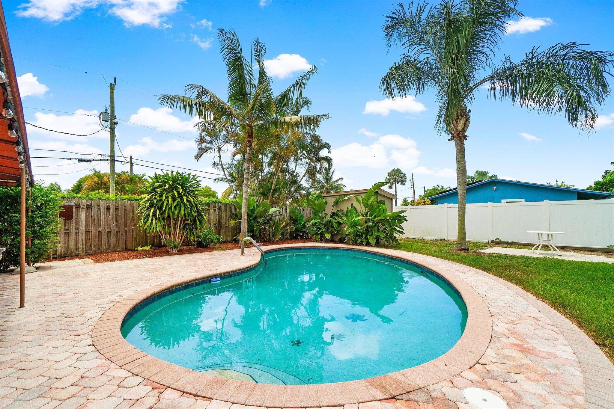 *Your Own Tropical Paradise On Just Under 1/2 Acre!*Imagine Jumping In This Refreshing Pool After Work!!*Waterfront To Miles and Miles of Fishing & Skiing Lakes-or The Hive For Dinner!*This Home Has Been Updated And Ready To Move In!!*Marble Throughout The Living Areas & Bamboo Bedrooms*Newer Kitchen With Granite, Upgraded Appliances, Bar Area & A Large Barstool Counter*Formal Dining & Large Living Room!*Garage Was Used For An Office With AC, But Is Still A Garage!*Newer AC 5Years w/ New Ductwork!*Newer Pool Pump*Electric Upgraded To 200 Amp Svc w/ Transfer Switch For Genie!*Roof 2013, Newer On Demand Wthr*Huge Covered Screened Patio W/ French Doors From Bedroom & Living!*2nd Covered Open Patio*Impact Windows!*Fenced Yard*2 Large Storage Sheds*FPL Putting Lines Underground!*Walk To Park-