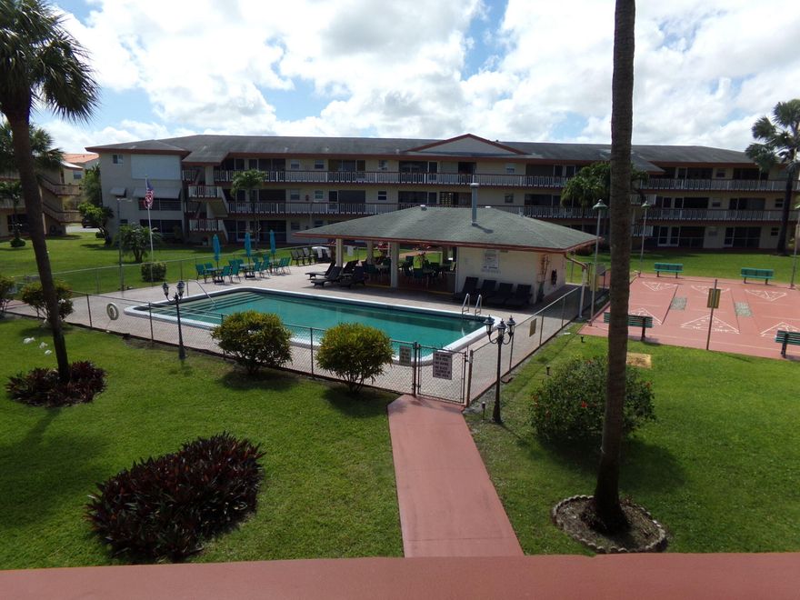 This charming 1-bedroom, 1-bathroom condo offers a bright and spacious living area filled with natural light, a comfortable primary bedroom with ample closet space, a beautifully remodeled bathroom, and a fully equipped kitchen with plenty of storage. Enjoy peaceful pool and garden views from your private screened balcony, along with access to a wide range of community amenities including a heated pool, fitness center, clubhouse, library, game room, social areas, BBQ facilities, bocce and shuffleboard courts, a courtesy bus, secure parking, gated access, and abundant guest parking—all within a vibrant 55+ community designed for comfort, convenience, and an active lifestyle.