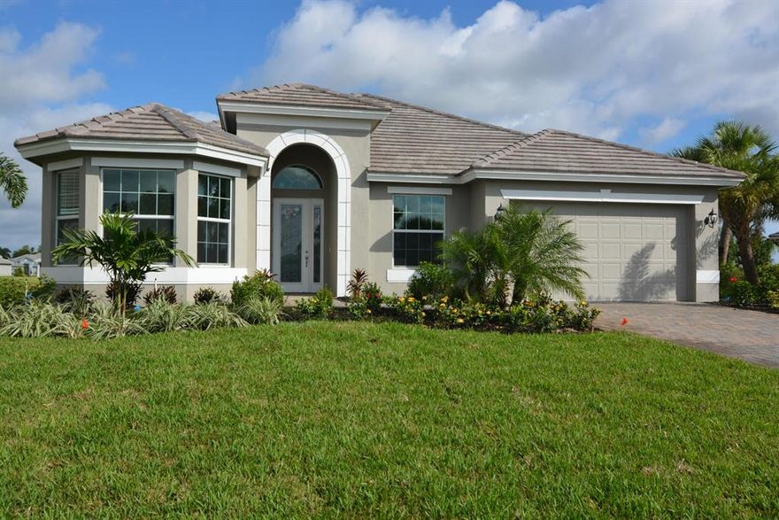 This beautiful GHO Homes Carmel Grande home with a classic elevation is lake front!! Tile roof, paver driveway & Lanai. IMPACT windows and Doors. Gourmet GE Profile kitchen with cook-top, vented hood, very quiet dishwasher, wall oven with microwave combo & French door refrigerator w/bottom freezer drawer. GE Laundry room appliances with upper & lower cabinet & utility tub. Wood look floor tile throughout and granite counter tops. Fourth room can serve as a bedroom/den/office. Many more extras in this house. Call Doris today!! HOA is $155/month and includes individual lawn care of homesites