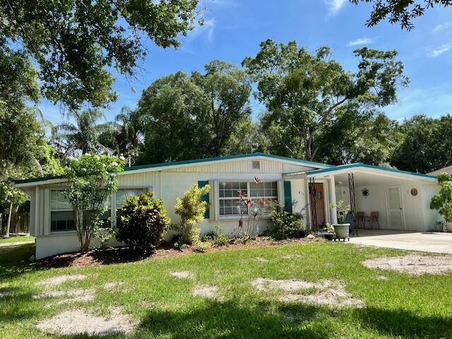 Relax in your adorable old Florida style CBS home located in a quiet neighborhood convenient to US 1. Well maintained and renovated. Living square footage much larger than Property Appraisers report with addition of large Florida room and screened patio. Newer appliances, newer a/c and new vinyl flooring in the living areas. Newer Windows throughout. Large carport with attached laundry and workshop. Hurricane shutters. Metal roof. Large, shaded back yard. This lovely home is move-in ready.