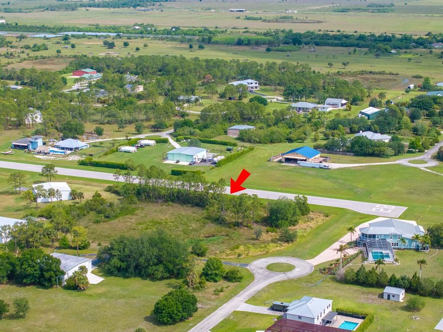 Build your custom dream home or just your own private hanger on this 2.3 acre private lot sitting right on the runway of Treasure Coast Airpark! This community offers a newly constructed 4,000-foot private, lighted asphalt runway and can accommodate aircraft up to 12,500 pounds. Enjoy the convenience of leaving your porch and flying anywhere your heart desires in just seconds.