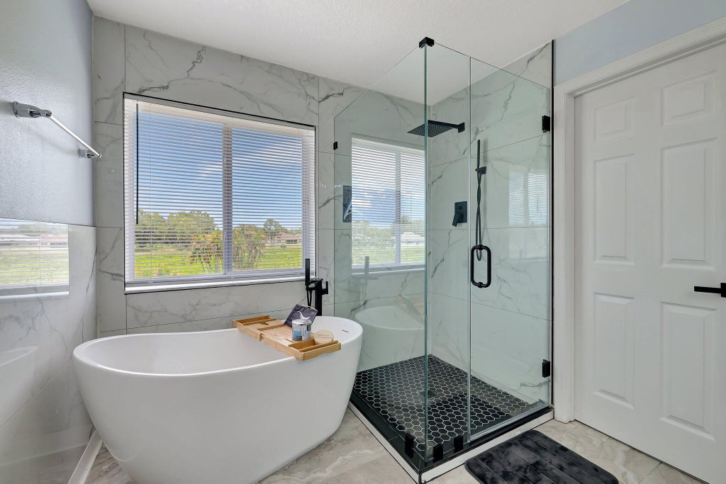 Photo of 6509 NW OMEGA Road, Port Saint Lucie, FL 34983 (MLS # B26067912)
