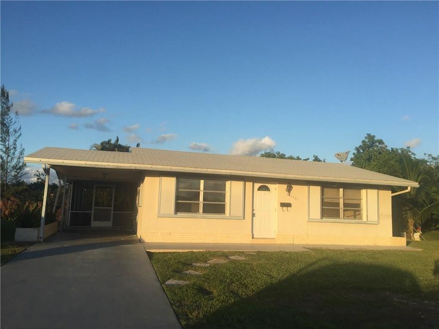 Cozy 2 bedroom/1 bath single family home on a canal, in desirable 55+ community. Florida room. Eat-in kitchen. Laundry room with full size washer and dryer. Freshly painted. Large yard. Large, covered wrap around porch plus carport. Well located near the turnpike, shopping, restaurants and golf courses. At least one owner must be 55+ and all occupants 18 and over. Very low HOA fees include mowing of lawn, sprinklers and all amenities. The perfect home to enjoy the Florida Retiree lifestyle!