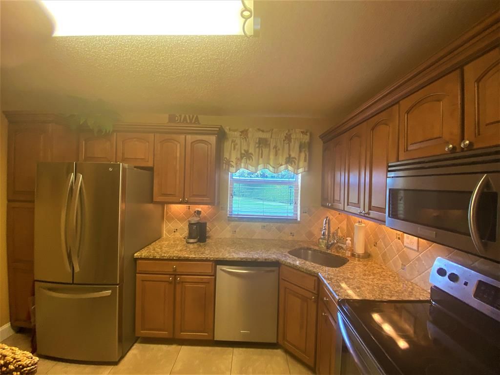 Photo of 21 Colonial Club Drive #101, Boynton Beach, FL 33435 (MLS # R10683752)