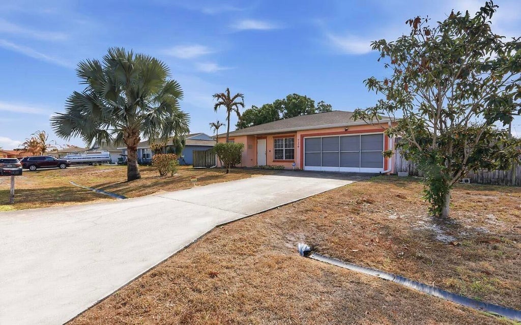 Photo of 726 SW BOND Road, Port Saint Lucie, FL 34953 (MLS # B26056683)