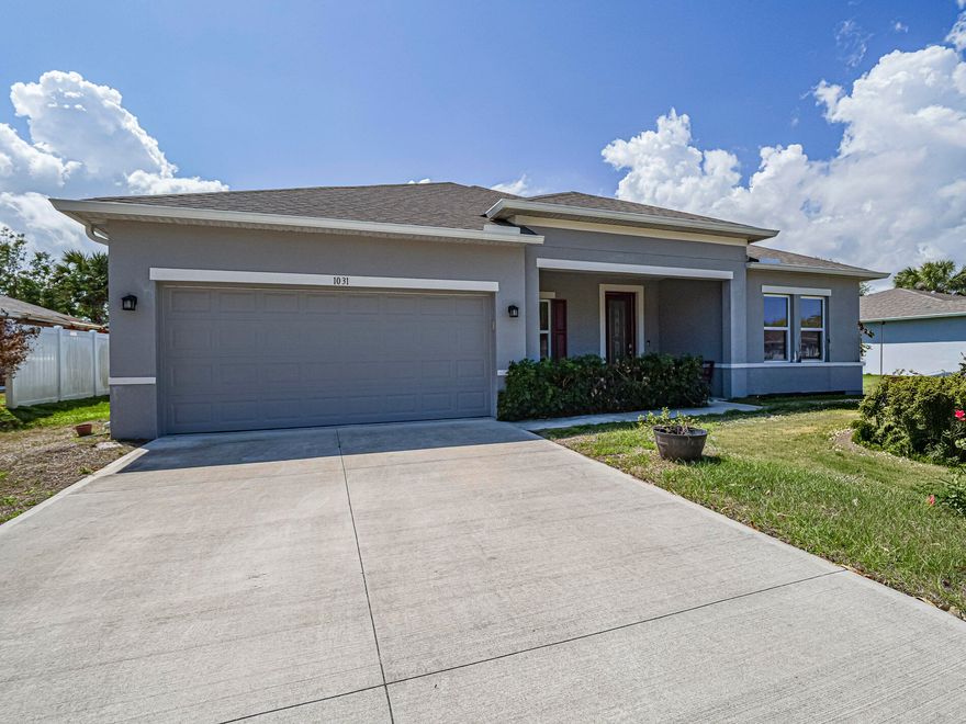 LIKE NEW beautiful 2022 built concrete block home located in the heart of Sebastian offers modern comfort w/ a spacious feel. Tile flooring throughout creates a clean + cohesive look. Enjoy an open-concept kitchen w/ stylish gray cabinets, stainless appliances + a large eat-in island. Peace of mind living w/ impact windows, whole-house Generac generator + 2.5 car garage for storage/workspace/gym. Cute breezy covered front porch to enjoy your morning coffee as the sun rises! This well-maintained home combines contemporary design w/ practical features - it's one you won't want to miss!