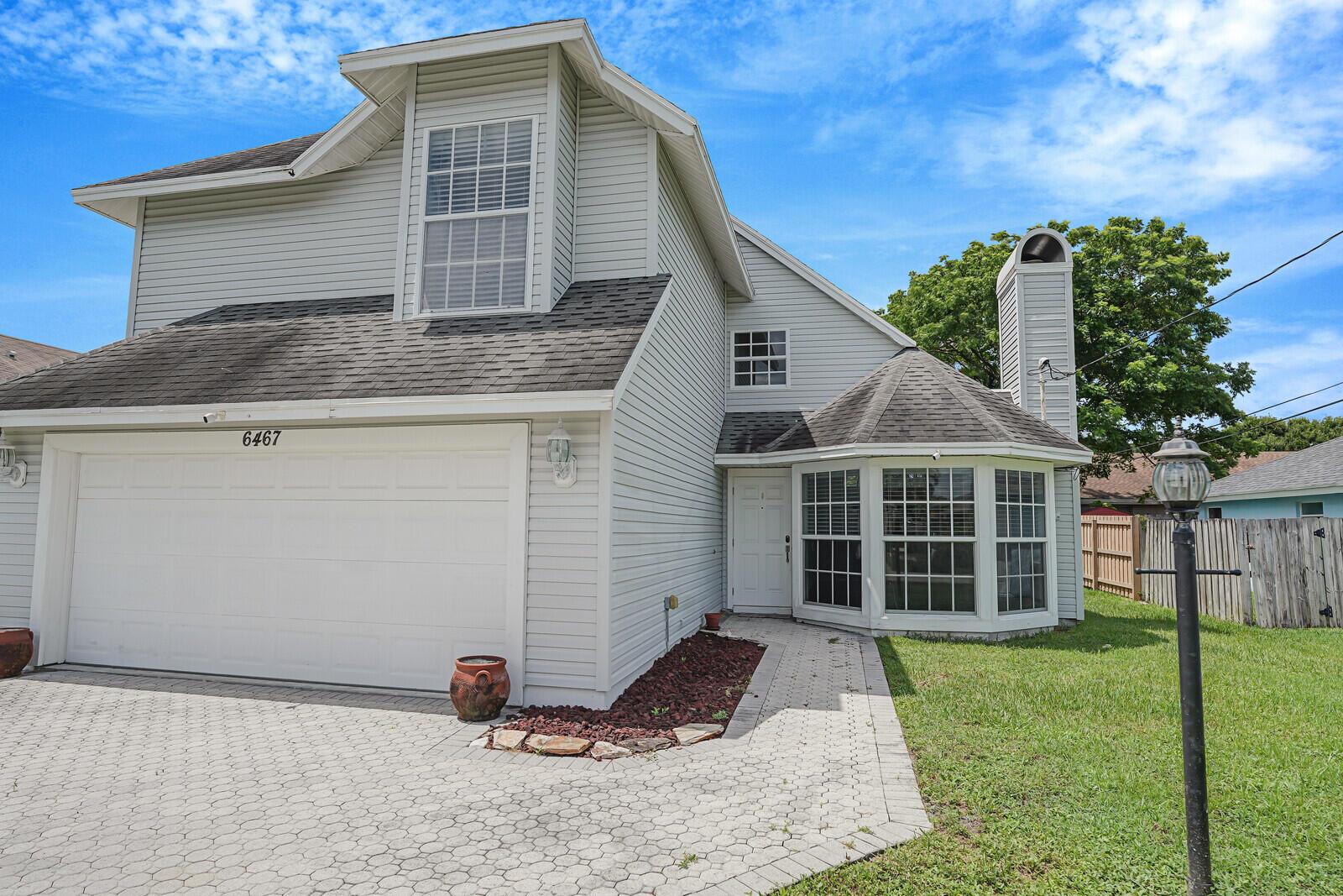 Welcome to your next home at 6467 Foster Street, Jupiter, FL! This charming 3-bedroom, 2.5-bathroom house offers 1,599 square feet of comfortable living space on a generous 6,003 square-foot lot. It's an unfurnished annual rental, perfect for those looking to settle in a vibrant community without the constraints of an HOA.Step inside to discover a bright and inviting atmosphere, highlighted by an airy layout with impressive vaulted ceilings in the living room. Enjoy cozy evenings by the fireplace, perfect for relaxing and unwinding. The kitchen features beautiful granite countertops, ideal for preparing meals and entertaining guests.Located close to downtown Abacoa, you'll have easy access to a variety of restaurants, shopping, and entertainment options.