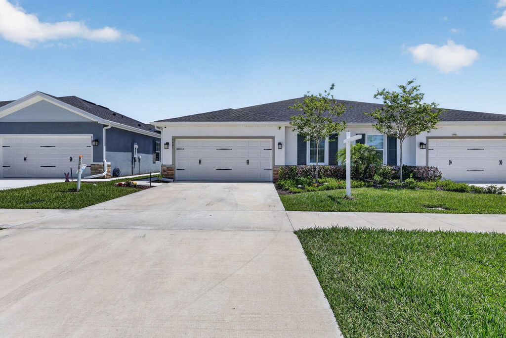 Photo of 9401 SW Libertas Way, Port Saint Lucie, FL 34987 (MLS # B26017651)