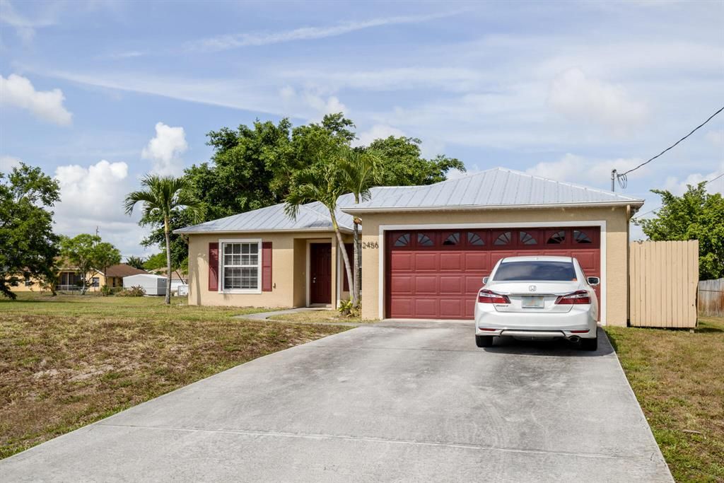 Photo of 2456 SW Monterrey Lane Ln, Port St Lucie, FL 34953 (MLS # R10716688)