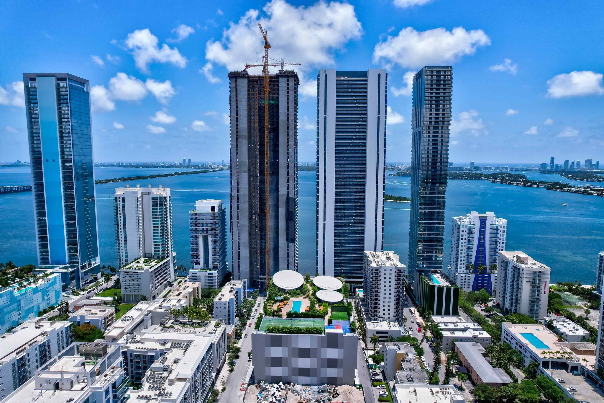 Welcome to Residence 1005 at Aria Reserve - a 3-bedroom, 3.5-bathroom, sanctuary on the 10th floor, where contemporary design meets breathtaking Biscayne Bay and Miami skyline views. This brand-new, never-lived-in residence features an expansive open-concept layout with floor-to-ceiling impact glass, filling the space with natural light and framing serene water and city vistas. This unit also features a Den. The sleek gourmet kitchen is designed for both entertaining and everyday elegance, while each generously sized bedroom includes its own en-suite bathroom, offering ultimate comfort, privacy, and modern sophistication. Private elevator access and secure garage parking enhance the sense of exclusivity, with only ~7 residences per floor.