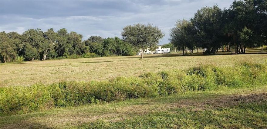 Great  opportunity to buy the very clean 2.5 acres lot. It is already surveyed. Ready to build your house or move your RV or Mobile Home. A lot of possibilities . Also you can a mini Farm: