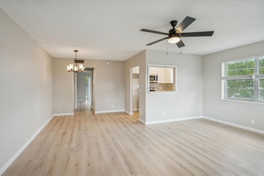 Come see this renovated 1 bedroom / 1.5 bathroom corner unit with a brand new central a/c system and upgraded electrical in the HOPA Community of Century Village in West Palm Beach! As you enter, you will notice the freshly painted neutral walls and upgraded LVP wood like flooring that gives the perfect contrast with the walls. The kitchen has been updated with brand new white shaker cabinets, quartz counters, under mount sink and stainless steel appliances. The large bedroom has plenty of closet space and a nice balcony to overlook the green space while sipping your morning coffee or reading a book. The full bathroom has updated wall tile that looks like marble. The spacious living room is perfect for entertaining! All new outlets, switches and electrical fixtures. Move-In Ready!!!!!!