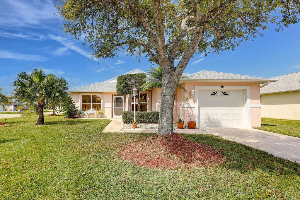 Photo of 360 Paurotis Lane, Fort Pierce, FL 34982 (MLS # R10968413)