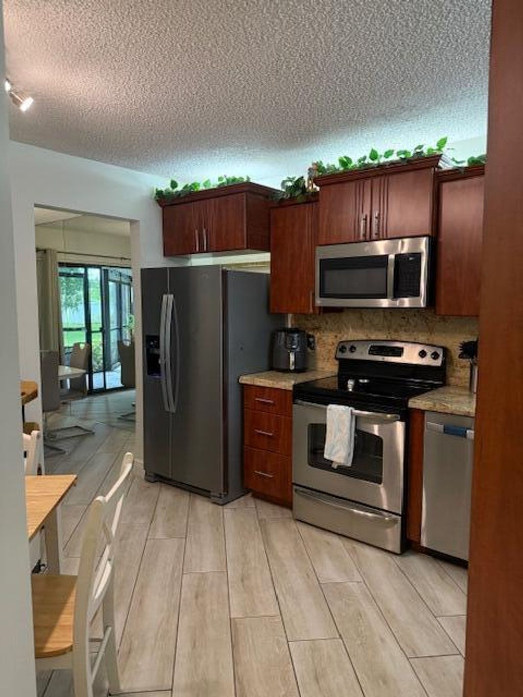 Photo of 5650 Camino Del Sol #102, Boca Raton, FL 33433 (MLS # R11113199)