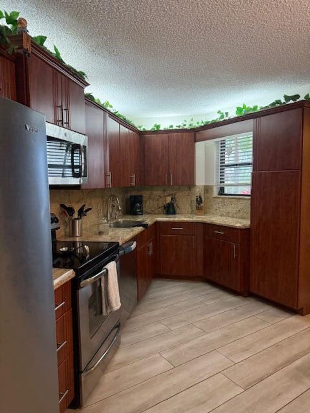 Photo of 5650 Camino Del Sol #102, Boca Raton, FL 33433 (MLS # R11113199)