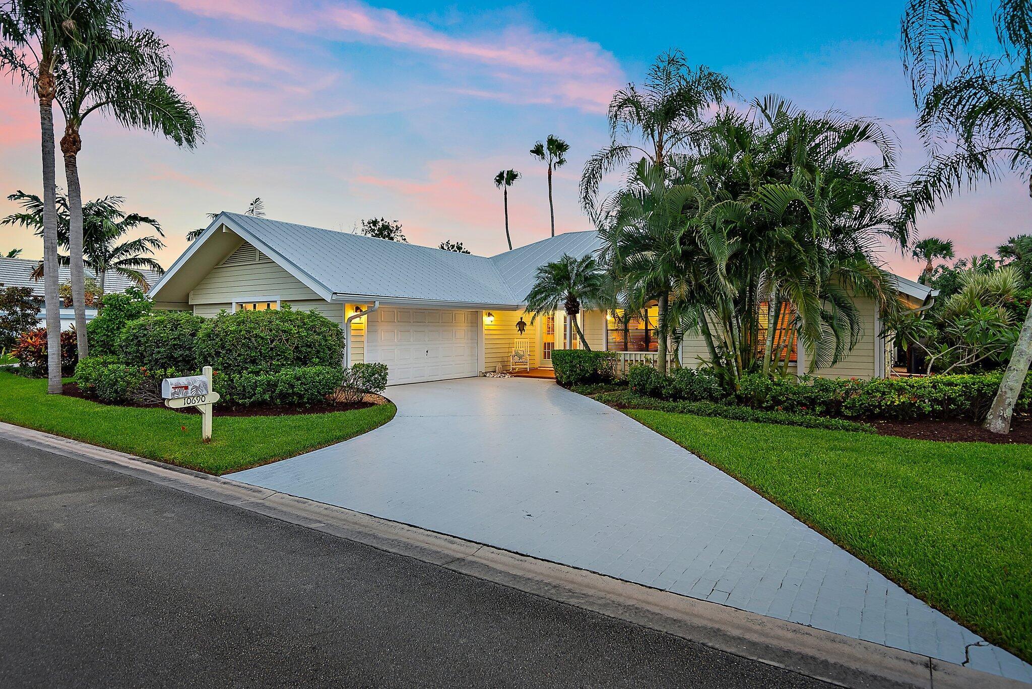 This charming Key West-style residence features three bedrooms, two bathrooms, and a spacious two-car garage. Nestled in a tranquil neighborhood surrounded by natural beauty, it's the ideal retreat for those who enjoy an active, outdoor lifestyle.Inside, the open-concept design creates a welcoming atmosphere, with the living, dining, and kitchen areas flowing seamlessly together. Expansive windows and sliding glass doors invite an abundance of natural light. The newly renovated kitchen boasts sleek stainless-steel appliances, high-end cabinetry, and expansive counter space. Designed with both style and function in mind, it's perfect for everyday meals as well as entertaining. A modern fume hood and thoughtful finishes complete the space.