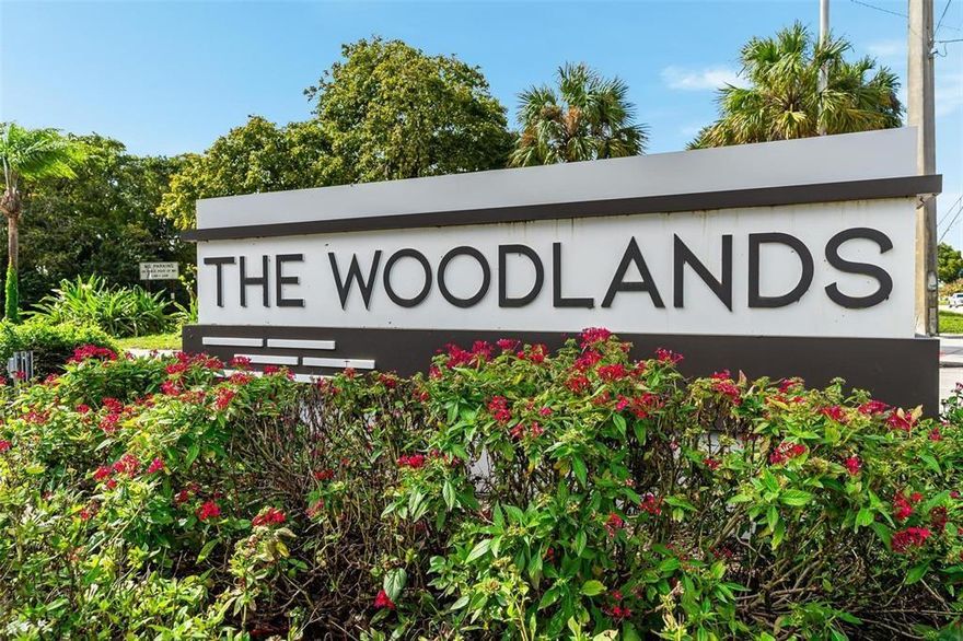 Welcome to your dream home in the prestigious WOODLANDS COMMUNITY! This remodeled 3/2 residence offers over 2,400 sq ft of luxurious living space on a spacious 0.28-acre lot. From the moment you arrive, you'll be captivated by the modern finishes, split floor plan, and rare 4-car garage—perfect for car enthusiasts or extra storage. Step inside to discover gleaming 24x24 MARBLE TILE FLOORS, WHITE SHAKER CABINETRY, and QUARTZ COUNTERTOPS throughout. The CHEF'S KITCHEN features stainless steel appliances and a breakfast nook. The expansive great room flows seamlessly into a game room and formal dining area, creating a versatile space for gatherings.  Enjoy peace of mind with a 2019 ROOF, updated electric, Wi-Fi smart home setup and 2 zone a/c. The screened lanai offers a tranquil retreat.