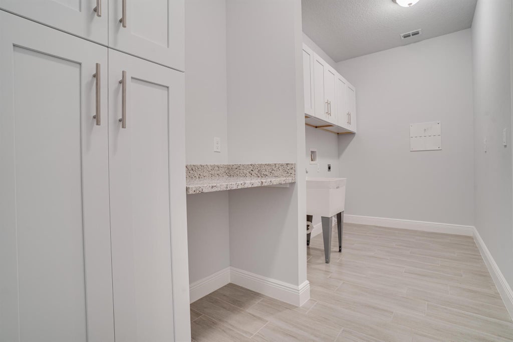 Photo of 5515 NW Downs Street, Port Saint Lucie, FL 34986 (MLS # R10884731)