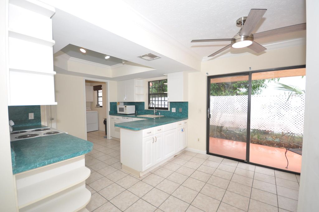 Photo of 10 Evergreen Drive, Lake Park, FL 33403 (MLS # R11169614)