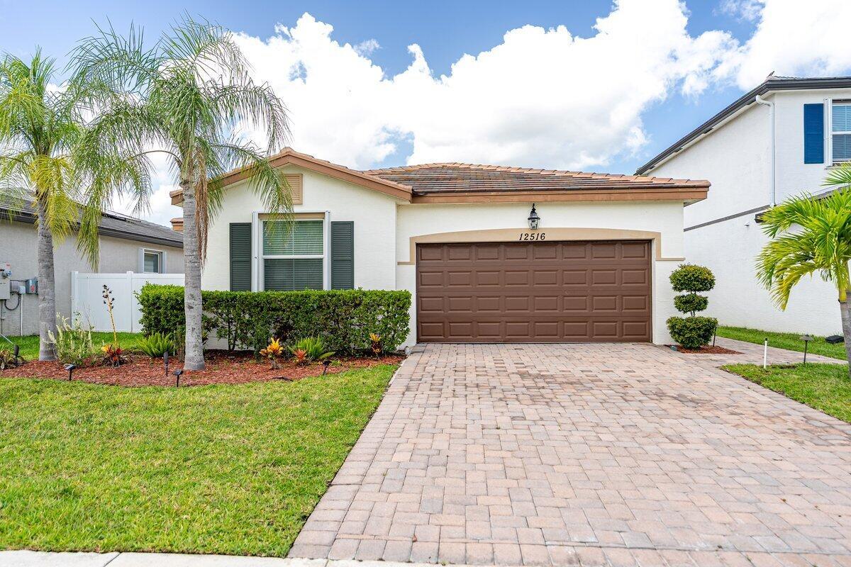 This SPACIOUS residence features 3 Bedrooms plus a DEN/OFFICE, Can be used as Home Office or easily converted into a 4th Bedroom. ALL NEW CARPETS AND WOOD FLOORS PLUS ACCORDION SHUTTERS. Roof, Appliances and A/C as NEW- BUILT IN 2019. The master suite is a retreat, showcasing elegant tray ceilings, expansive walk-in closets, and a spa-like ensuite with dual sinks for added convenience. On the opposite side of the home, you'll find the two additional bedrooms and a dedicated laundry room, thoughtfully placed for privacy and functionality. Step outside to your backyard oasis, where a semi-fenced patio invites you to relax, entertain, or grill the perfect steak in a peaceful, private setting. Enjoy resort-style living. The community offers amenities for the whole family.