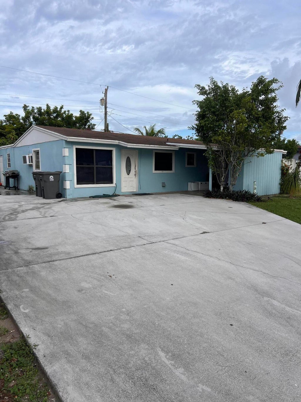 Photo of 5776 Gramercy Drive, West Palm Beach, FL 33407 (MLS # R11015765)