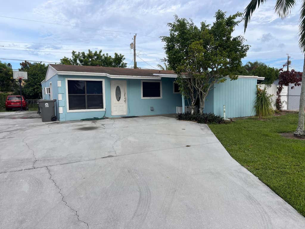 Photo of 5776 Gramercy Drive, West Palm Beach, FL 33407 (MLS # R11015765)