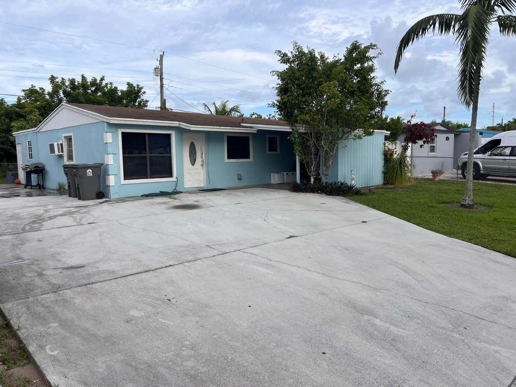 Photo of 5776 Gramercy Drive, West Palm Beach, FL 33407 (MLS # R11015765)