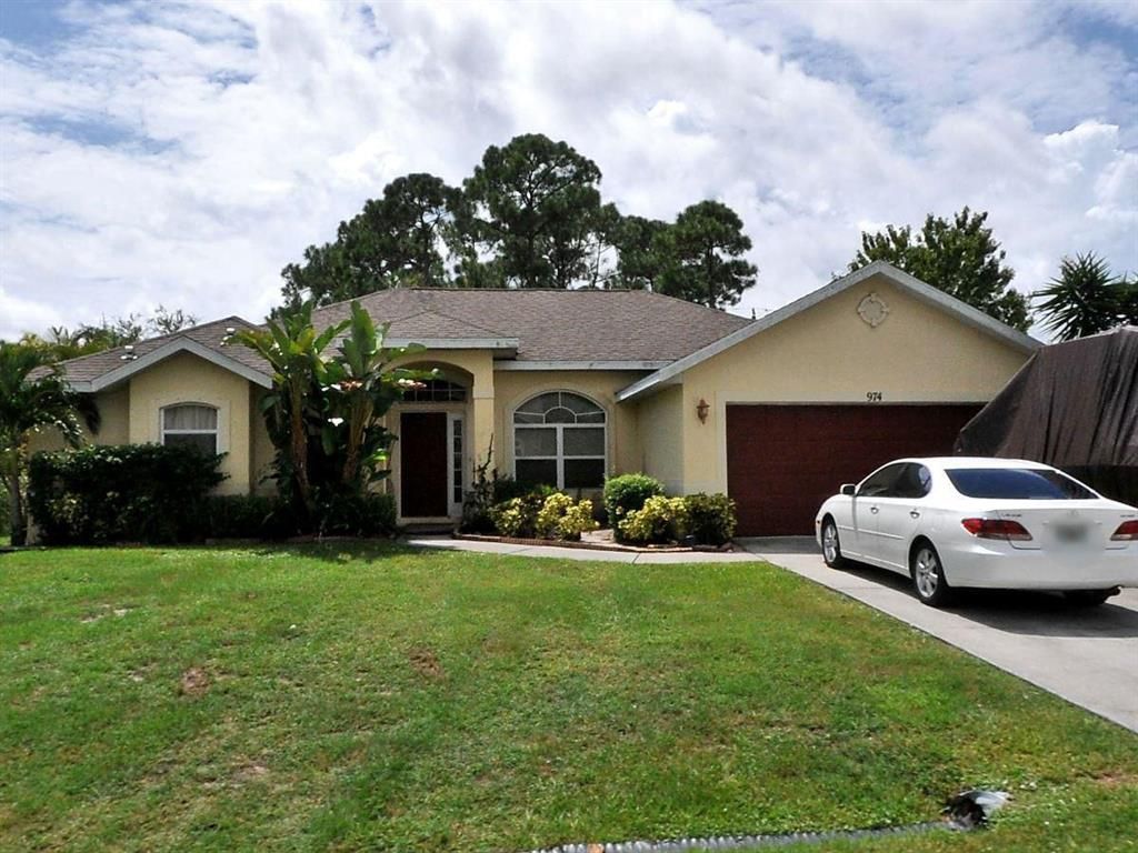 Photo of 974 SW North Globe Avenue, Port Saint Lucie, FL 34953 (MLS # R10683758)