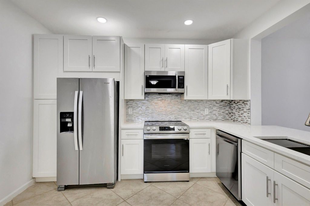 Photo of 137 Cypress Point Drive, Palm Beach Gardens, FL 33418 (MLS # R10943786)