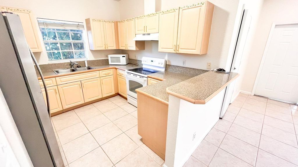 Photo of 1440 Hawthorne Place, Wellington, FL 33414 (MLS # B26026919)