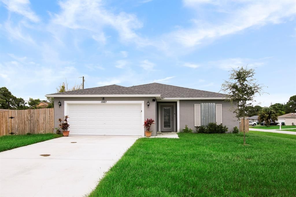 Photo of 1987 SW Gold Lane, Port Saint Lucie, FL 34953 (MLS # R10744636)