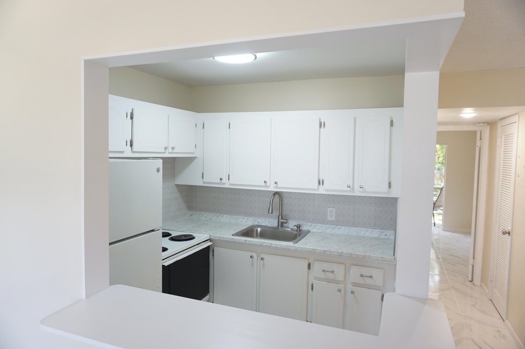 Photo of 33 Windsor B, West Palm Beach, FL 33417 (MLS # B26077244)