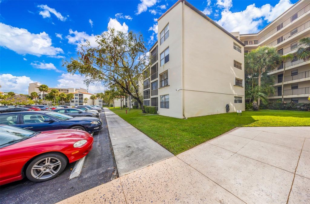 Photo of 2312 S Cypress Bend Drive #105, Pompano Beach, FL 33069 (MLS # F10471784)