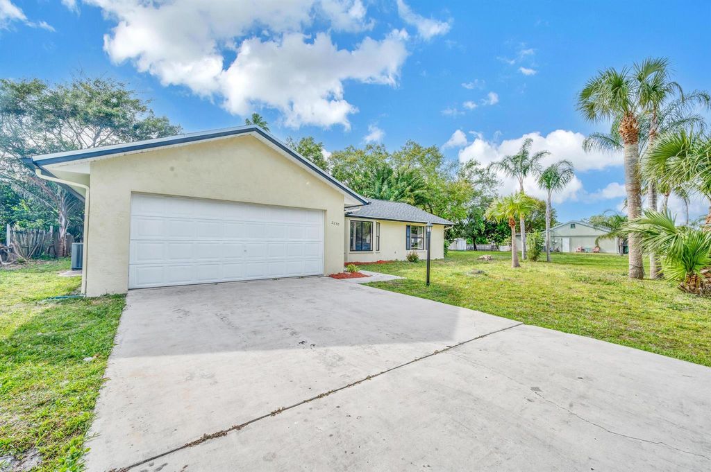 Photo of 2250 SE Shelter Drive, Port Saint Lucie, FL 34952 (MLS # R10991347)