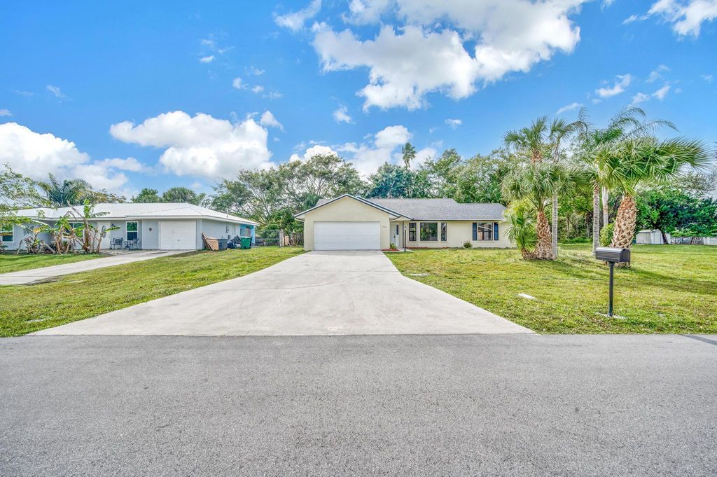 Photo of 2250 SE Shelter Drive, Port Saint Lucie, FL 34952 (MLS # R10991347)
