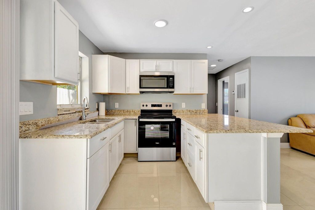 Photo of 212 Palmetto Drive, Lake Park, FL 33403 (MLS # R11091441)