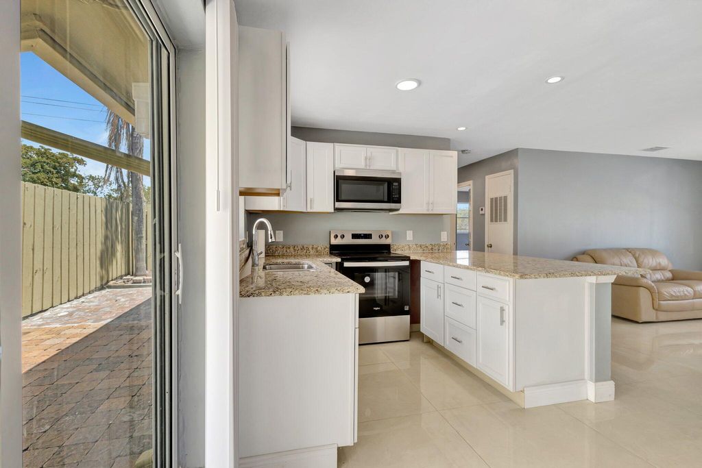 Photo of 212 Palmetto Drive, Lake Park, FL 33403 (MLS # R11091441)