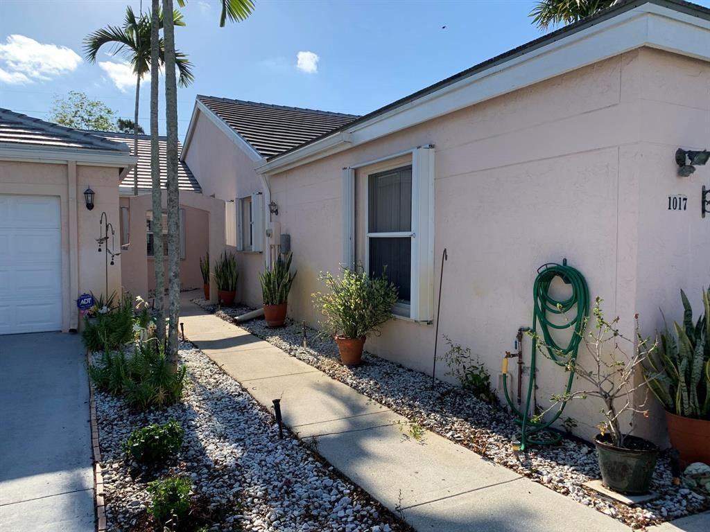 Photo of 1017 Island Manor Drive Dr, Green Acres, FL 33413 (MLS # R10720518)