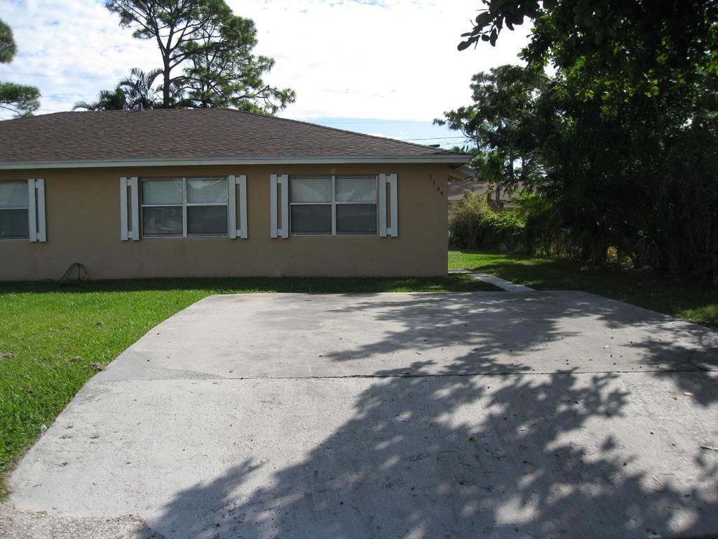 Photo of 3594 Almar Road Rd, Lake Worth Beach, FL 33461 (MLS # R10818596)