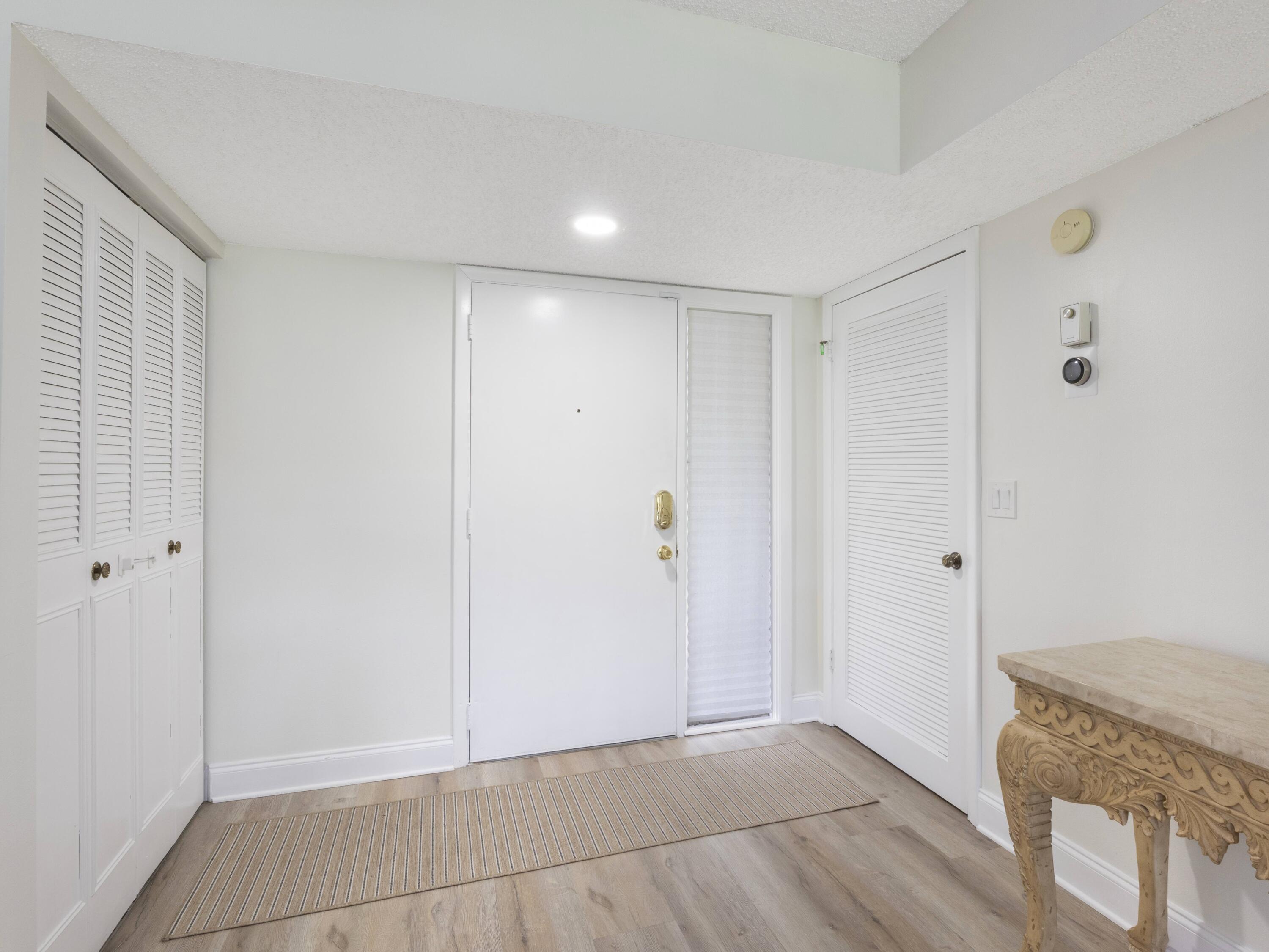 Welcome to this beautifully updated 2 bed, 2 bath, 2nd floor condo located in the highly sought-after 55+ Green Lakes community within the prestigious Indian Spring Country Club in Boynton Beach. Perfectly positioned within a secure, guard-gated neighborhood set directly on the golf course and just minutes from premier shopping, dining, and South Florida's award-winning beaches, this residence offers the perfect balance of comfort, style, and convenience.