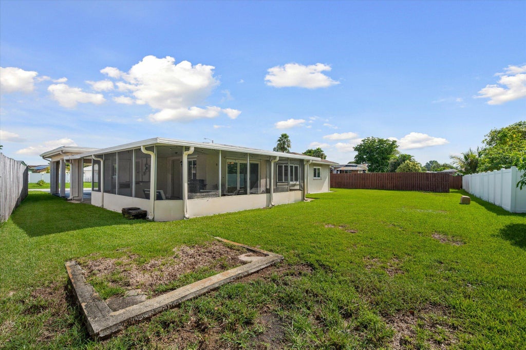 Photo of 9704 NW 67TH Street, Tamarac, FL 33321 (MLS # B26085576)
